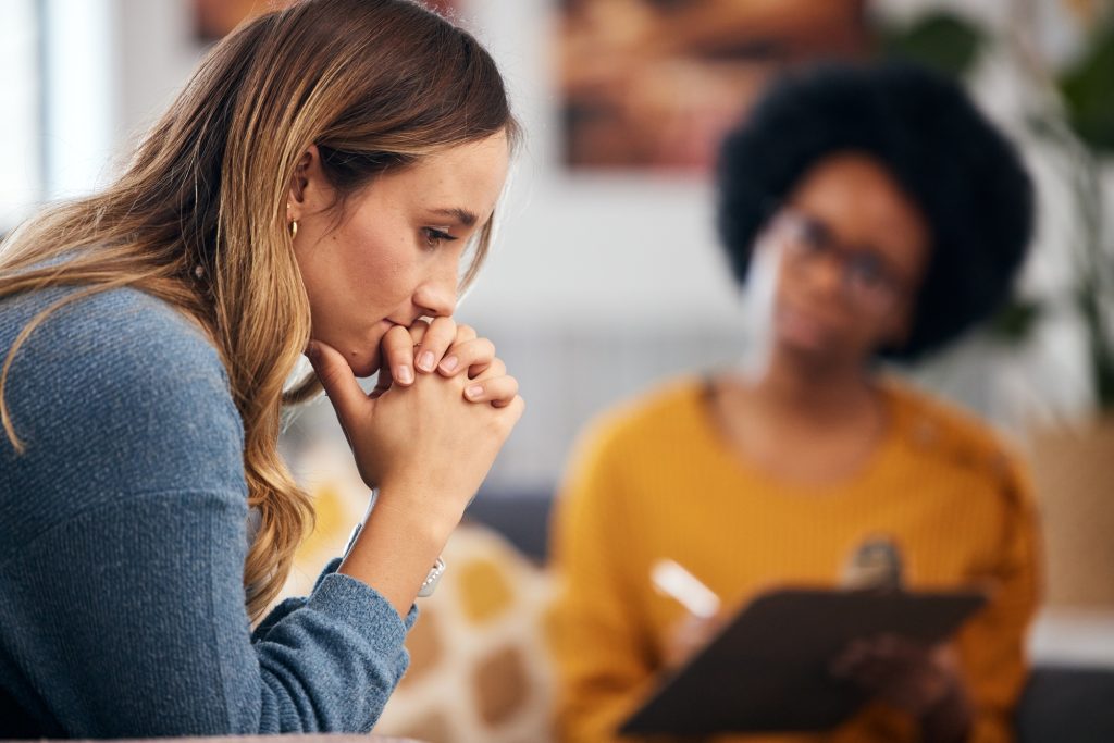 Woman thinking, stress and therapy by psychologist, therapist or healthcare professional with check
